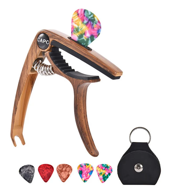 Gitarrkapo med plektrumhållare och plektrum för elgitarr och ukulele