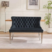 Sammetsklädd 2-sits matbänk i svart med tuftad rygg, wing back-design och ben i borstat silver, mid-century modern stil